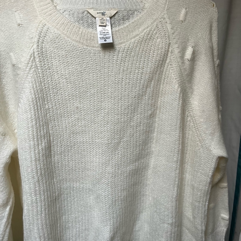 New with out tag, light weight, cream in color sweater.